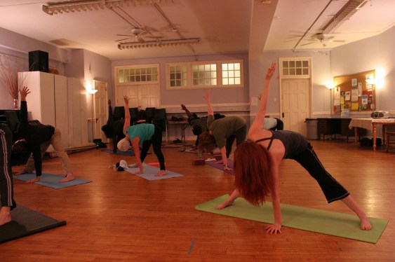 Flexible people in a Yoga studio
