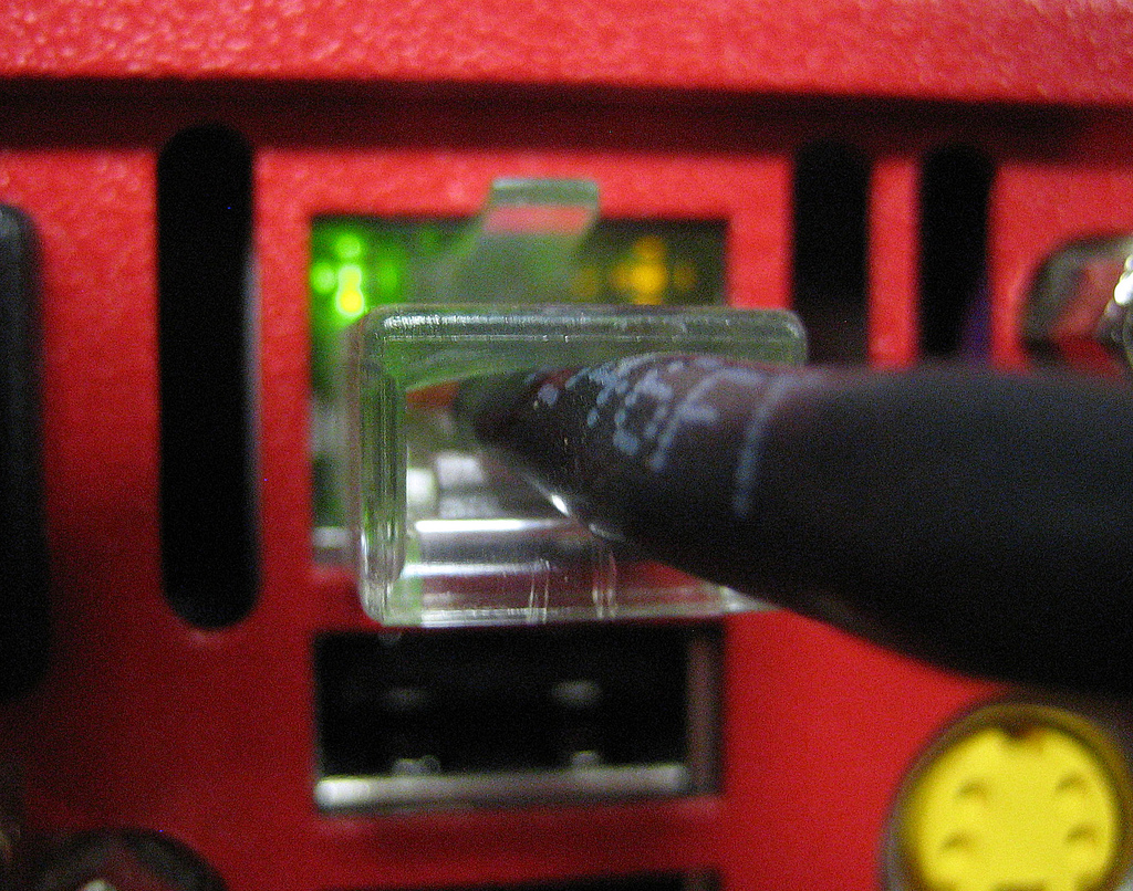 Extreme close up of a plugged in ethernet cable.