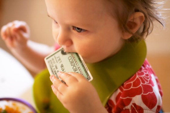Child biting an American Express card.