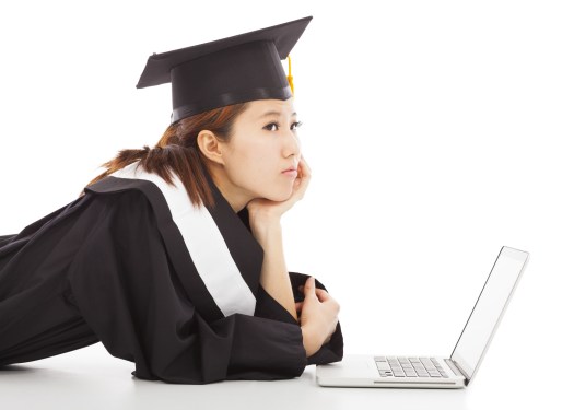 graduate with laptop