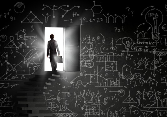 person on stairway with briefcase
