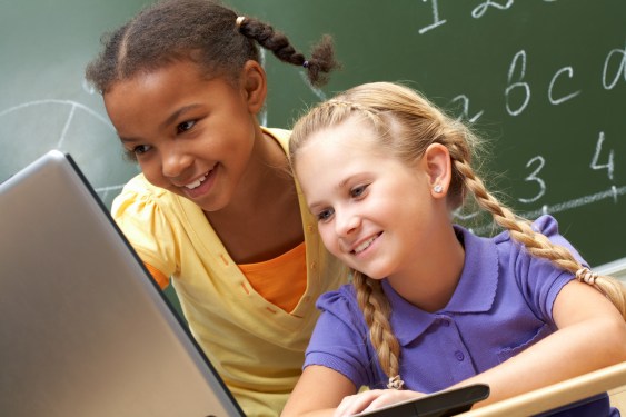 girls learning on a laptop
