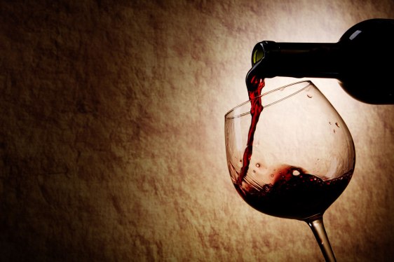 red wine being poured into a glass