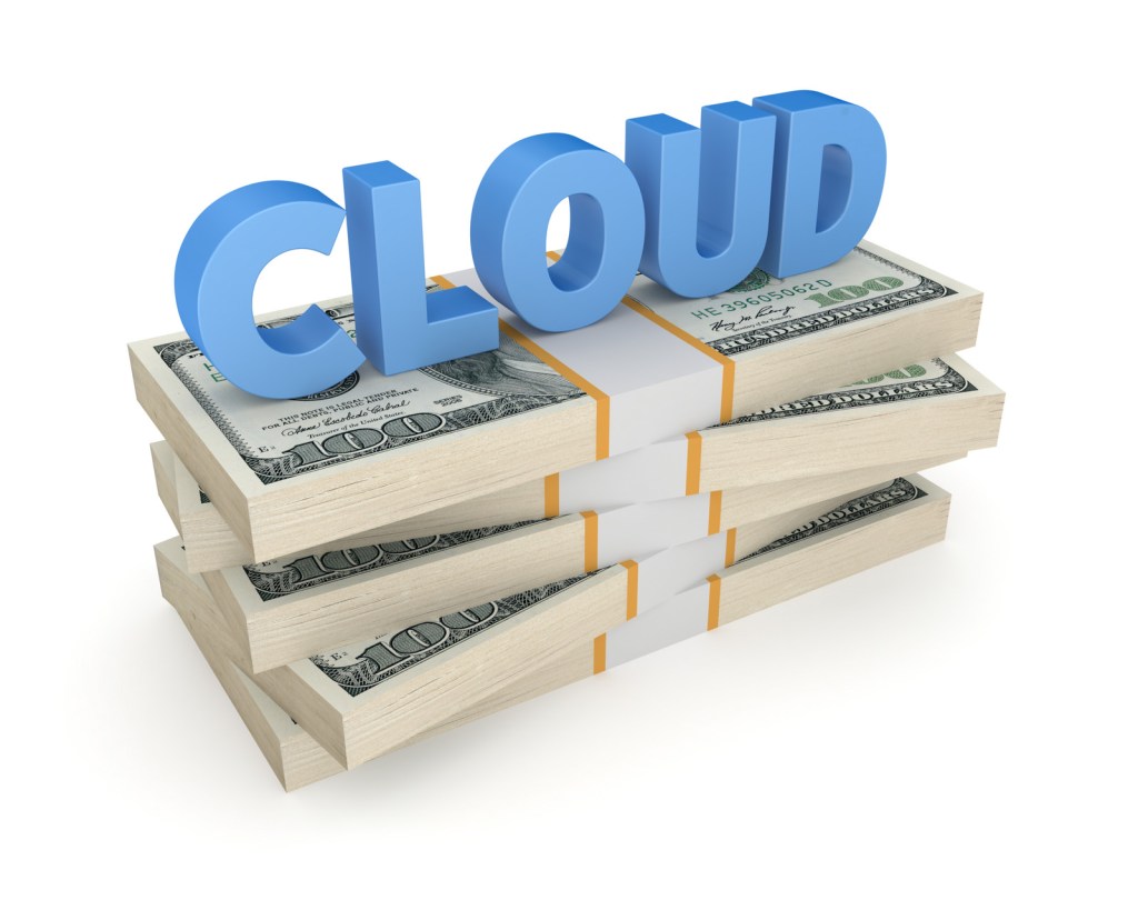 Word "cloud" on stacks of money.