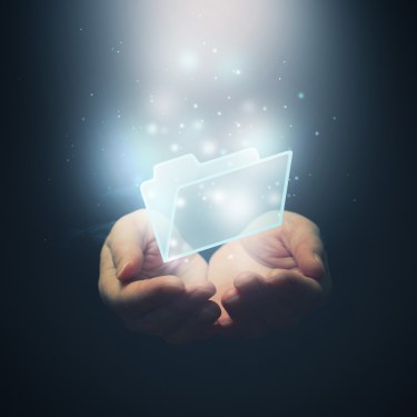 Concept photo of folder sitting inside two open hands.
