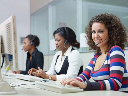 Women working in small customer service center.
