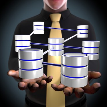 Database concept illustration. Man holding connected databases.