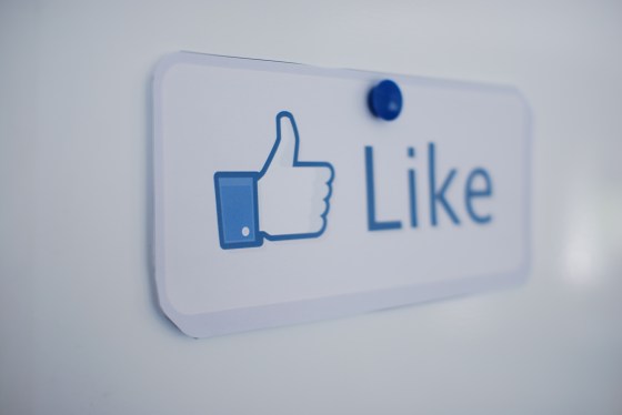 Facebook Like button on a work bulletin board.