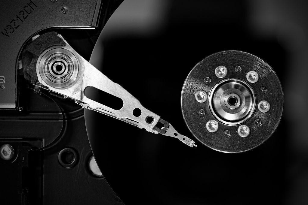 Black and white photo of spinning hard drive.