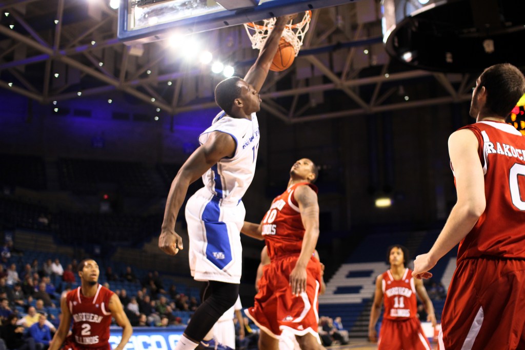 Basketball player dunking a basketball