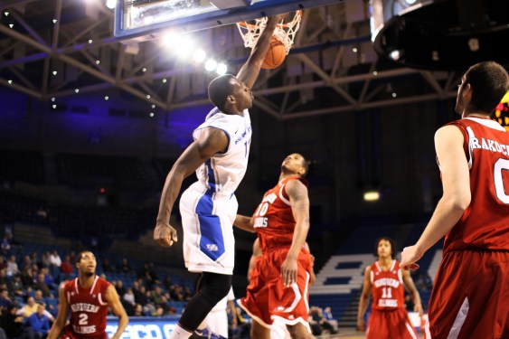 Basketball player dunking a basketball