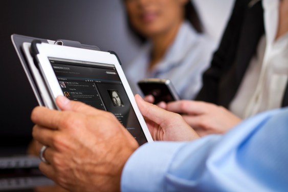Man holding tablet.