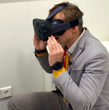 Man wearing HTC Vive VR goggles.