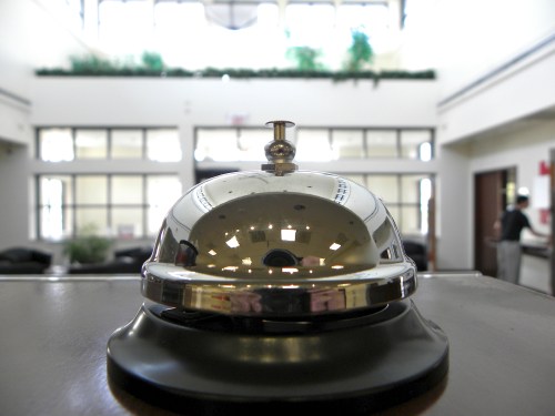 Kind of bell you ring for service sitting on a desk.