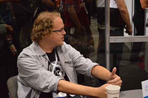 Etsy CTO Kellan Elliott-McRea chatting at a table.