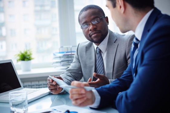 Salesman discusses terms with customer.