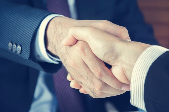 Two men shaking hands.