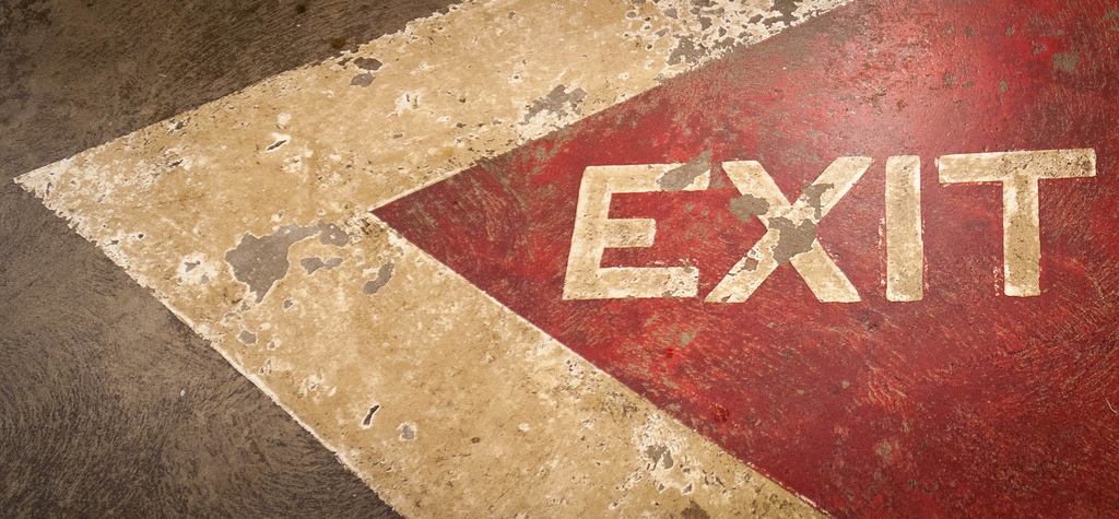 Exit sign painted on ground.