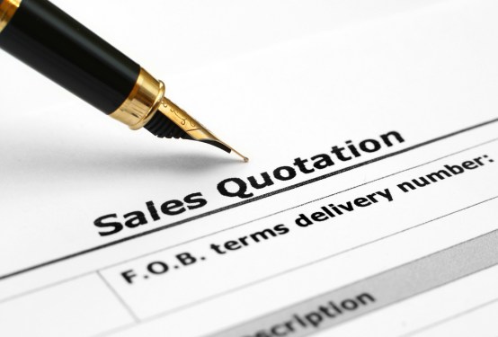 Sales quotation with fountain pen poised above it.