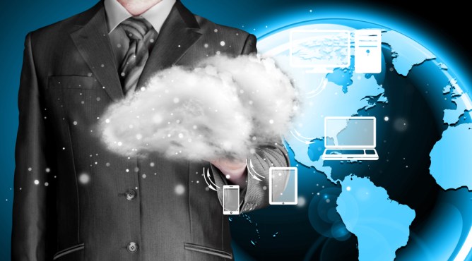 Business holding cloud apps over globe background.