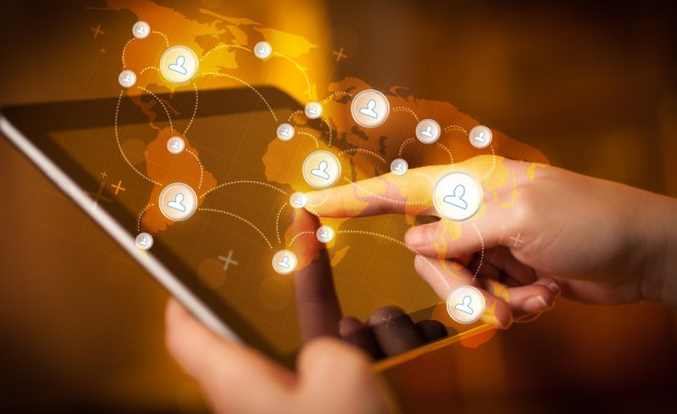 Social network graph coming off a tablet.
