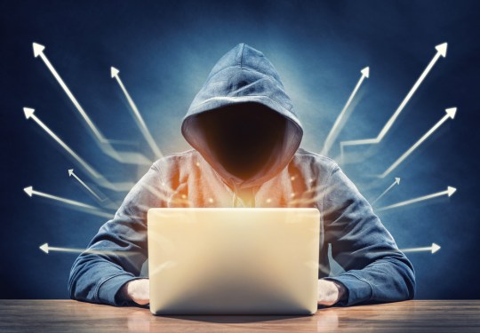 Hacker working on a system.