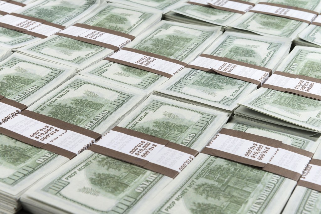 stacks of hundred dollar bills
