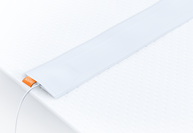 Beddit 3's sensor feels and looks like a strip of cloth that runs across your mattress. It tracks respiration rate, heart rate, and movement. 