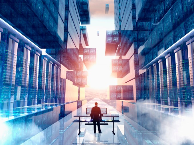 Businessman in virtual computer room.