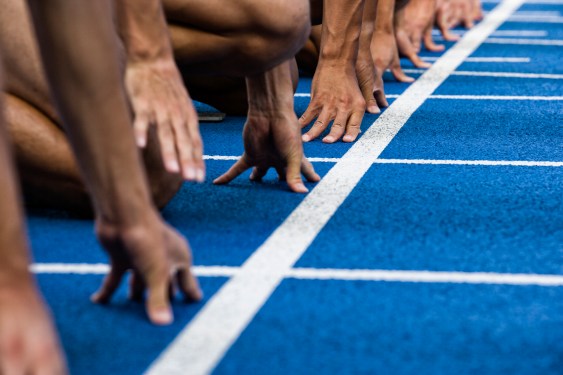 Track sprinters lined up at starting