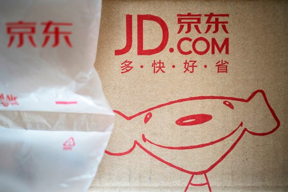 BEIJING, CHINA - 2017/06/12: Logo and mascot of JD.com, printed on the packing boxes for logistics. According to Jingdong's fiscal report of the first quarter in 2017, the net income reached 76.2 billion yuan (about 11.1 billion U.S. dollars), increasing by 41.2% over the same period, and the net profit amounted to 1.4 billion yuan, exceeding last year's annual profit which was 1 billion yuan. This is the first time of a single earning quarter since Jingdong had been listed on NASDAQ. (Photo by Zhang Peng/LightRocket via Getty Images)