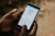 Hands holding smartphone displaying Tala app