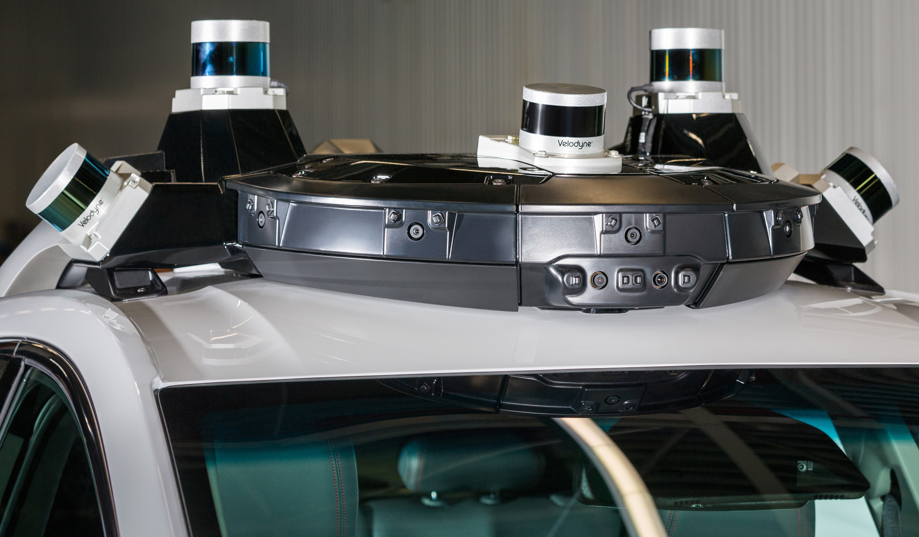 Lidar units on top of a GM vehicle.