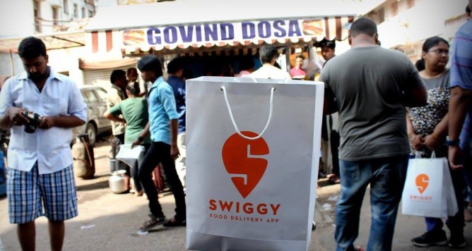 Swiggy bag in street scene
