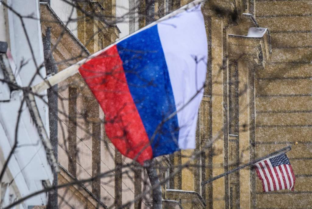 A Russian flag flies next to the US embassy