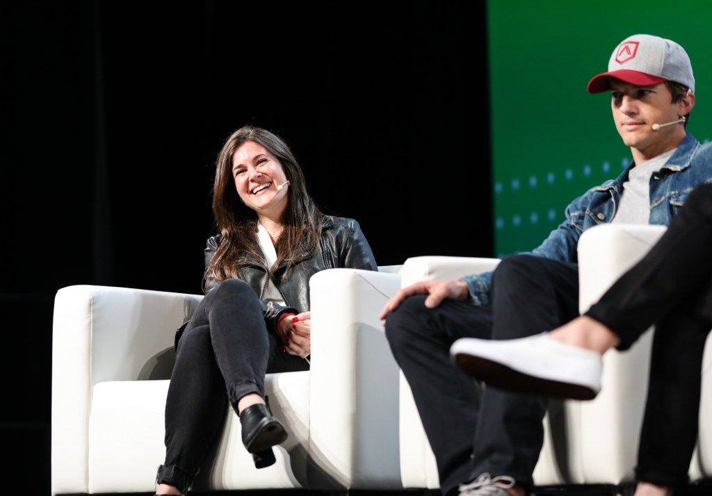 Ashton Kutcher and Effie Epstein onstage at TechCrunch Disrupt