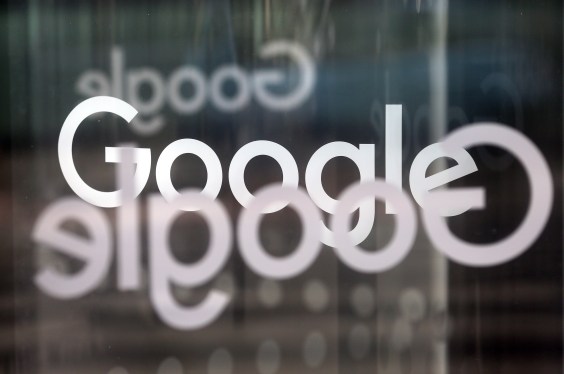 The Google Inc. company logo sits on revolving doors