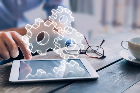 Business process management automation concept using internet technology and ERP (Enterprise Resource Planning) to improve productivity and efficiency, businessman touching computer screen, AR gears