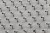 a pattern of CCTV surveillance cameras on a wall, all pointing in different directions.