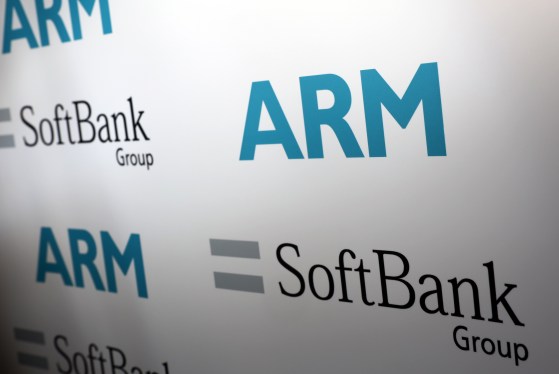 Logos of ARM Holdings Plc and SoftBank Group Corp sit on a background during a news conference in London, U.K., on Monday, July 18, 2016. SoftBank Group Corp. agreed to buy ARM Holdings Plc for 24.3 billion pounds ($32 billion), securing a slice of virtually every mobile computing gadget on the planet and future connected devices in the home. Photographer: Chris Ratcliffe/Bloomberg via Getty Images