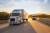 freight semi truck 18 wheeler sunrise on highway
