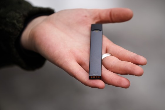 Woman holding Juul e-cig