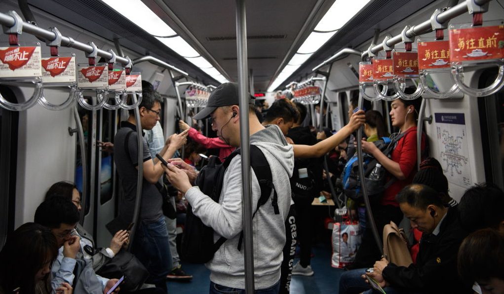 china office workers riding subway