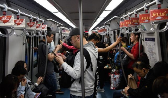 china office workers riding subway
