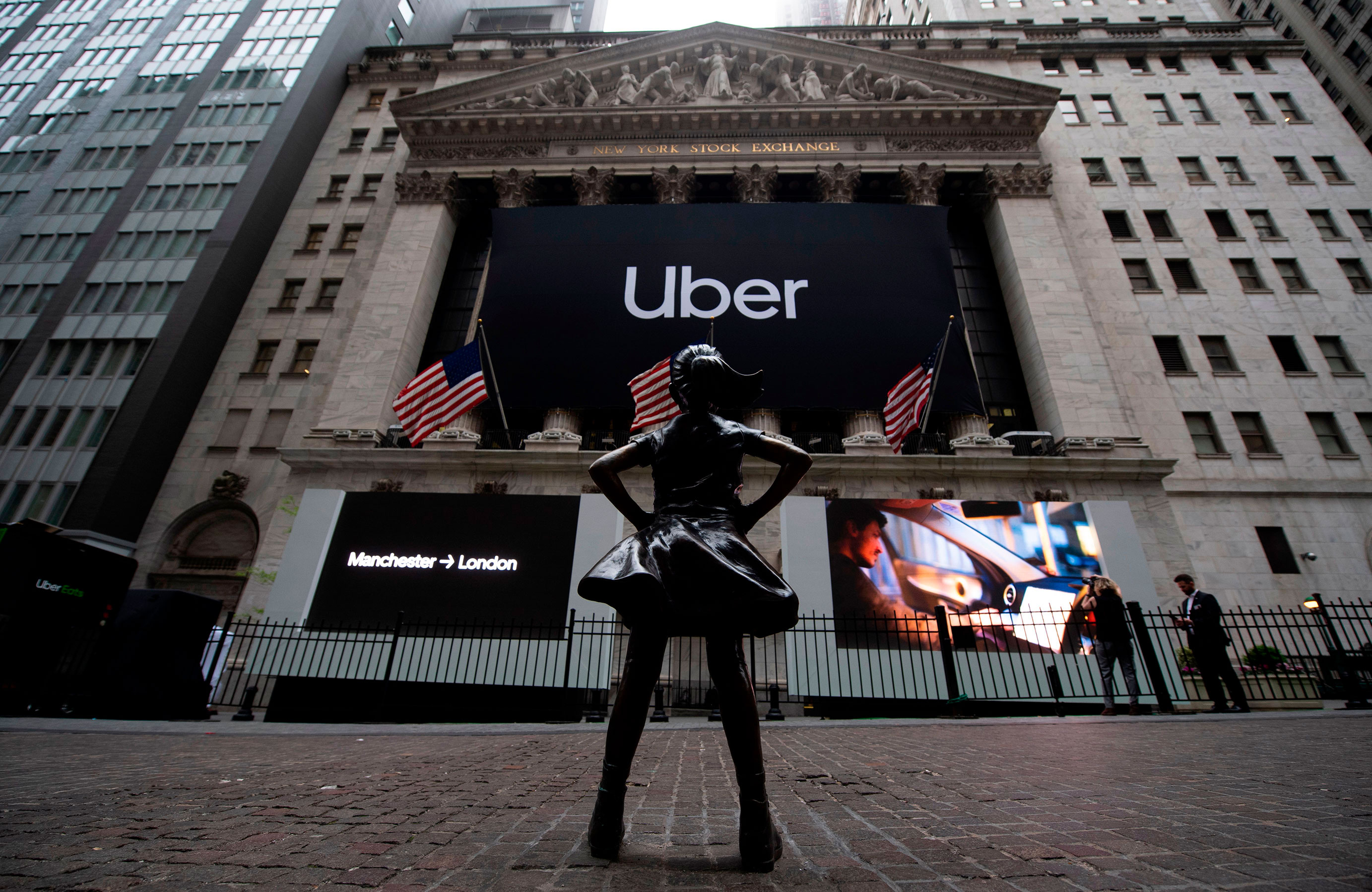 The "Fearless Girl" statue, by sculptor Kristen Visbal, stands outside the New York Stock Exchange (NYSE) ahead of Uber's IPO
