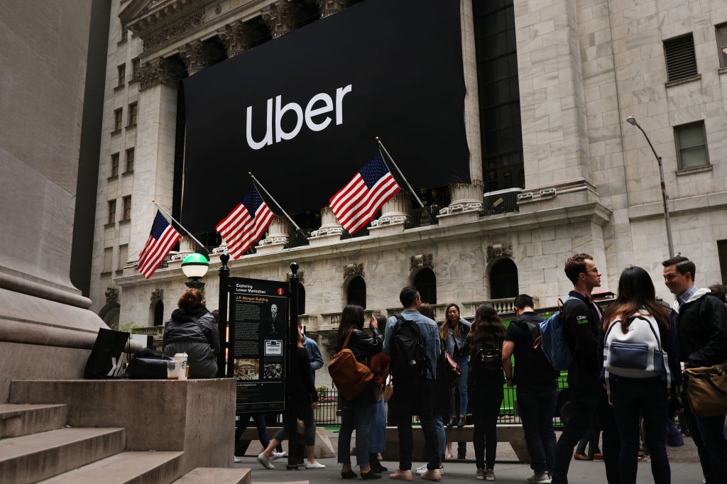 The Uber banner hangs outside of the New York Stock Exchange (NYSE) before the Opening Bell at the NYSE as the ride-hailing company Uber makes its highly anticipated initial public offering
