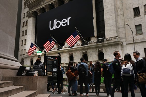 The Uber banner hangs outside of the New York Stock Exchange (NYSE) before the Opening Bell at the NYSE as the ride-hailing company Uber makes its highly anticipated initial public offering