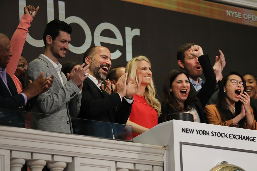 Uber CEO Dara Khosrowshahi (center) joins other employees in ringing the Opening Bell at the New York Stock Exchange