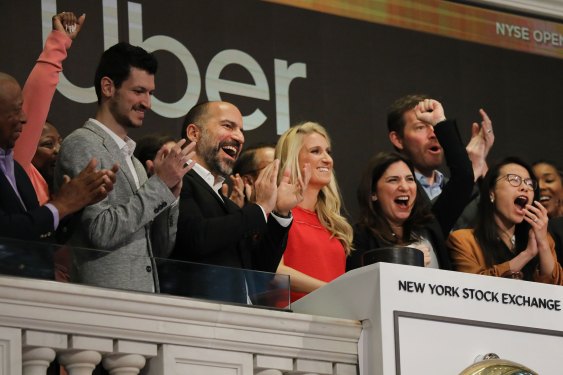 Uber CEO Dara Khosrowshahi (center) joins other employees in ringing the Opening Bell at the New York Stock Exchange