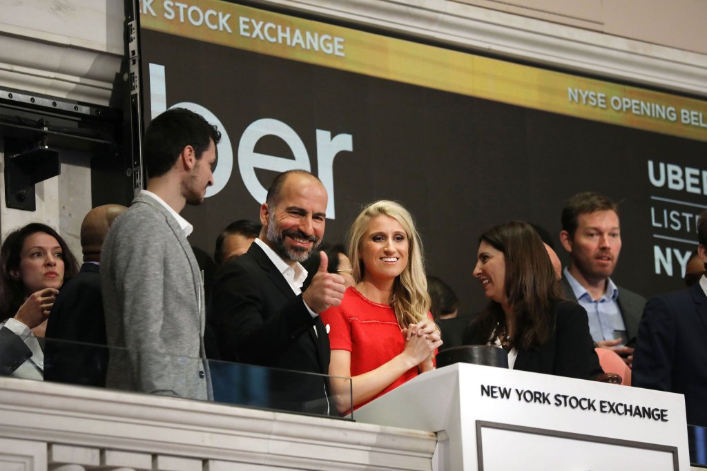 Uber CEO Dara Khosrowshahi (center) joins other employees in ringing the Opening Bell at the New York Stock Exchange